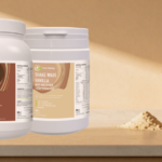 three protein powder bottles on thekitchen desk next to protein shaker